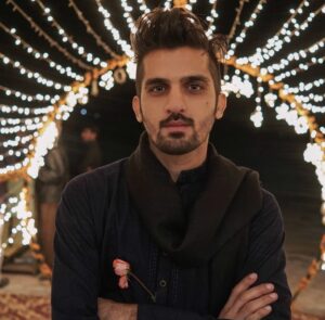 Smiling Indian user confidently using a cricket betting platform on a laptop, showcasing live match odds and promo banners with a badge saying “Trusted Online Cricket ID – Over 1 Year Experience