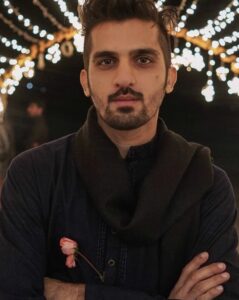 Smiling Indian user confidently using a cricket betting platform on a laptop, showcasing live match odds and promo banners with a badge saying “Trusted Online Cricket ID – Over 1 Year Experience