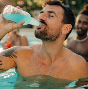 Happy person holding a phone with LemonBook open, showing ₹100 bonus message and golden coins around, smiling because the bonus was easy to claim and fun to use.